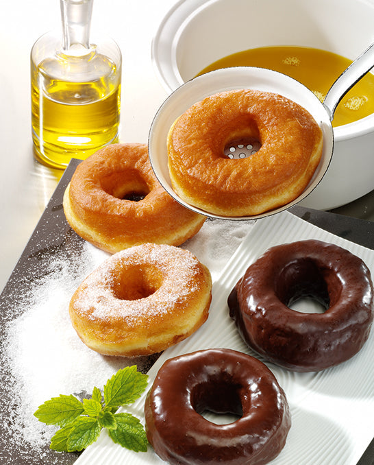 Donuts baked with Brändle frying oil. A few donuts are glazed with chocolate.