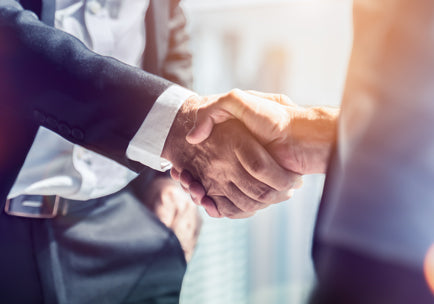 Two business partners shake hands