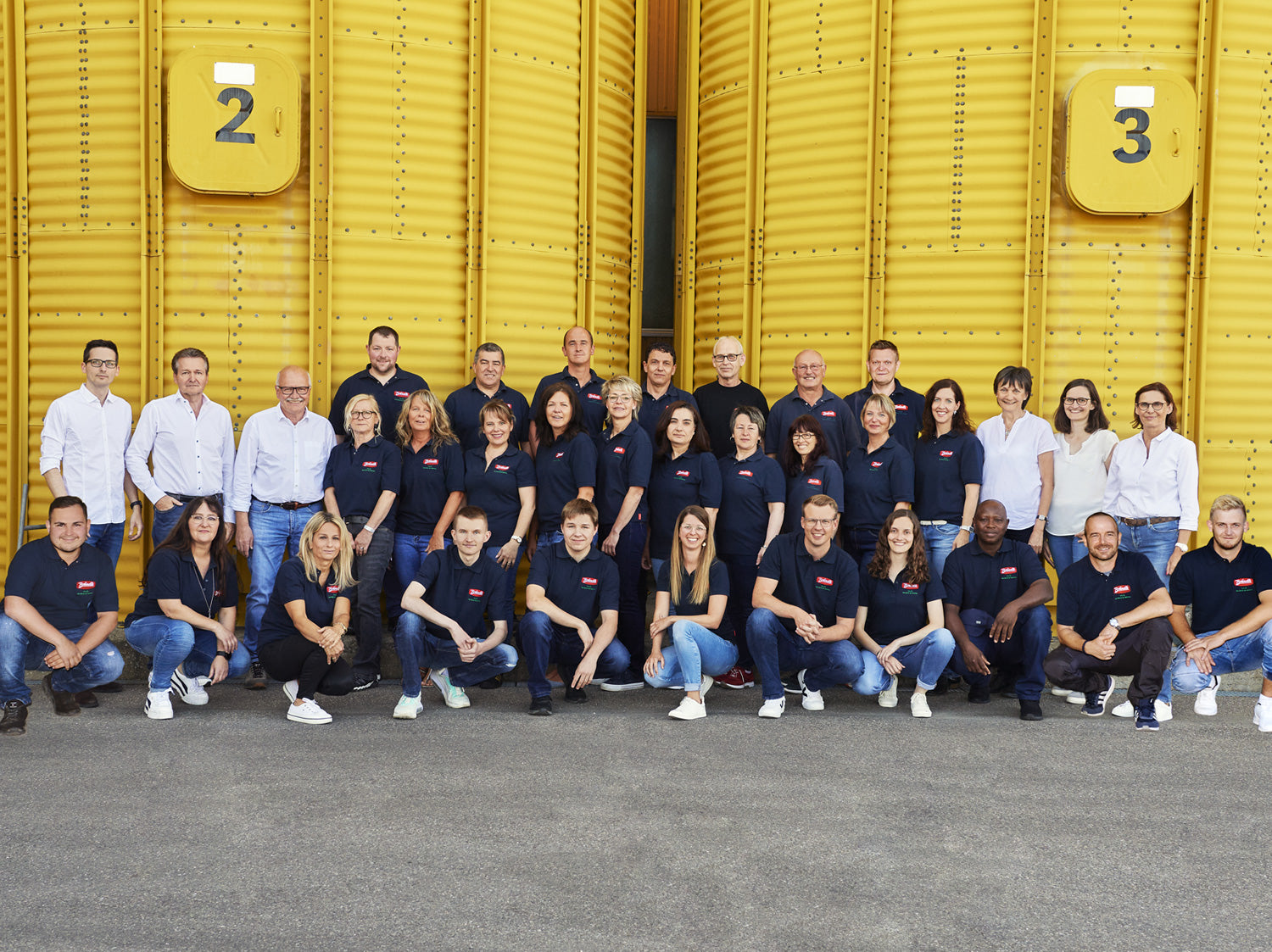 All Brändle employees and the management stand outside of the company Brändle in Empfingen
