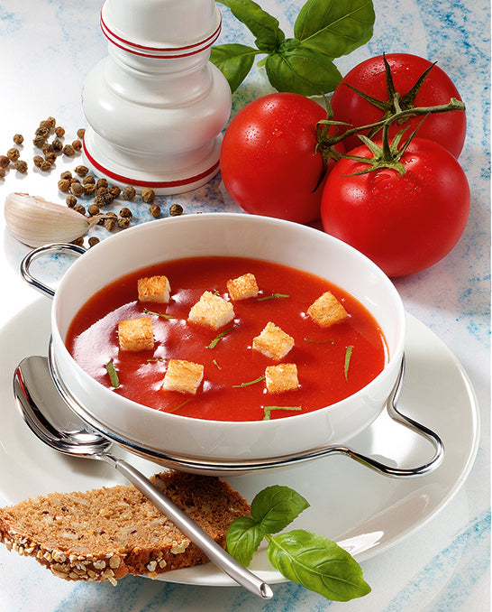 Tomato soup with croutons served with bread